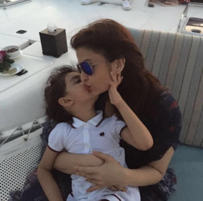 Aishwarya Rai Bachchan's daughter Aaradhya lovingly kisses her in this wonderful picture from their Maldives holiday.