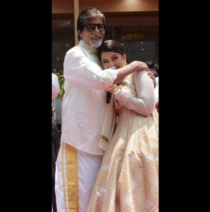Amitabh Bachchan and Aishwarya Rai Bachchan share a warm hug.