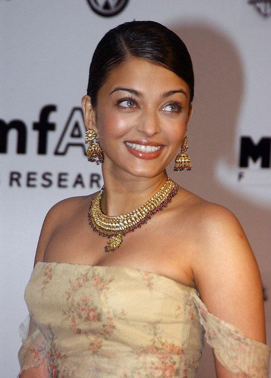 Aishwarya Rai poses for photographers at the amFar (American Foundation for Aids Research) benefit party at Cannes on May 22, 2003