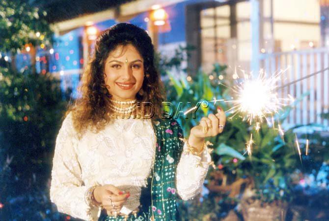 Jhulka further added, 'I think acting came to me naturally as I used to spend a lot of time in front of the mirror wrapping my mother's scarf around me and enacting the scenes from the movies.'
Pictured: Ayesha Jhulka celebrating Diwali back in her younger days