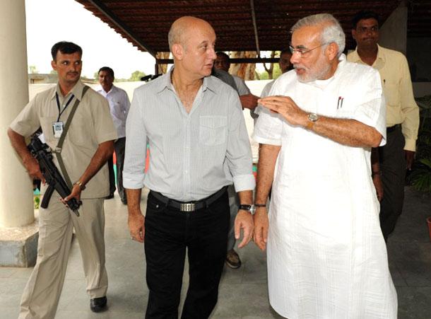 Anupam Kher talks to Narendra Modi after the inauguration of the 'Actor Prepares' school for aspiring actors at Charodi village on the outskirts of Ahmedabad on July 20, 2009. The Ahmedabad branch of the Actor Prepares school has a swimming pool, gymnasium and a horse-riding school and is spread in over 2.5 acres. Pic/AFP