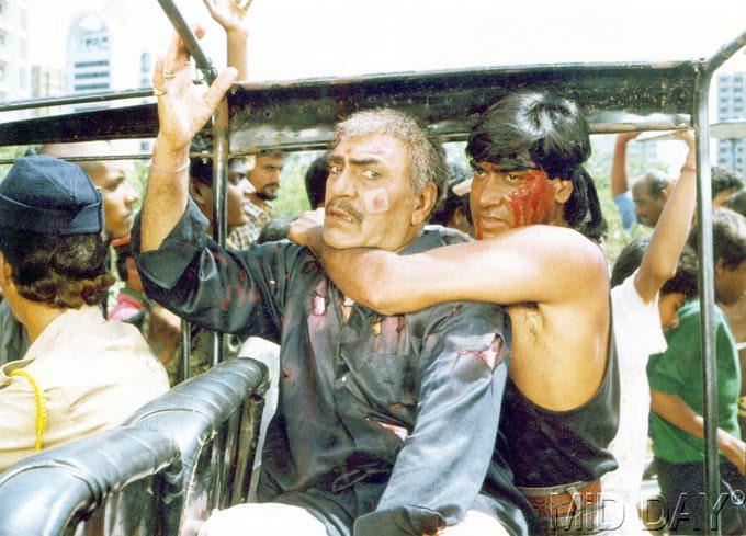 Action time again: Ajay Devgn and Amrish Puri in a still from a film.