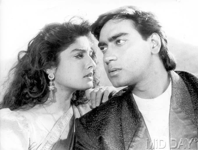 Ajay Devgn with Raveena Tandon in a still from Dilwale (1994). The film was directed by Harry Baweja and it also starred another action star of the '90s - Suniel Shetty.