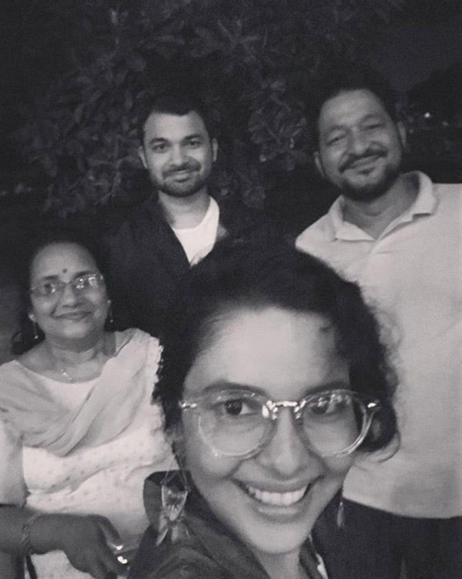 Chitrashi Rawat clicks a black-and-white picture with her parents Tirath Singh Rawat and Yashoda Rawat, and brother.