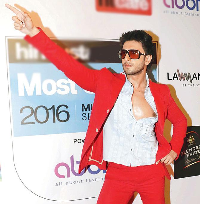 Ranveer Singh, to no one's surprise, won everyone over with his antics on the red carpet of this award show dressed in a bright red suit with his shirt unbuttoned