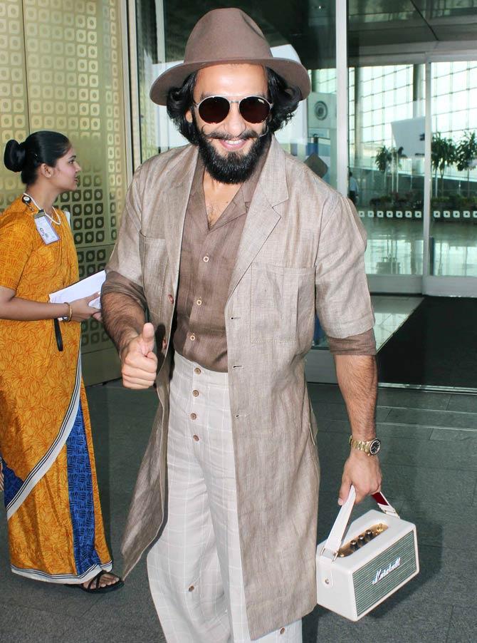 Ranveer Singh sported a retro 80s look with a bag shaped like a boom box, complete with a long jacket, a hat and wide bottom linen pants