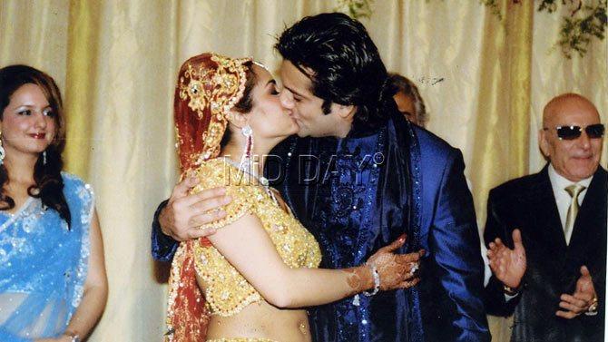 In picture: Fardeen Khan and his wife Natasha Madhwani share an intimate kiss during their wedding ceremony