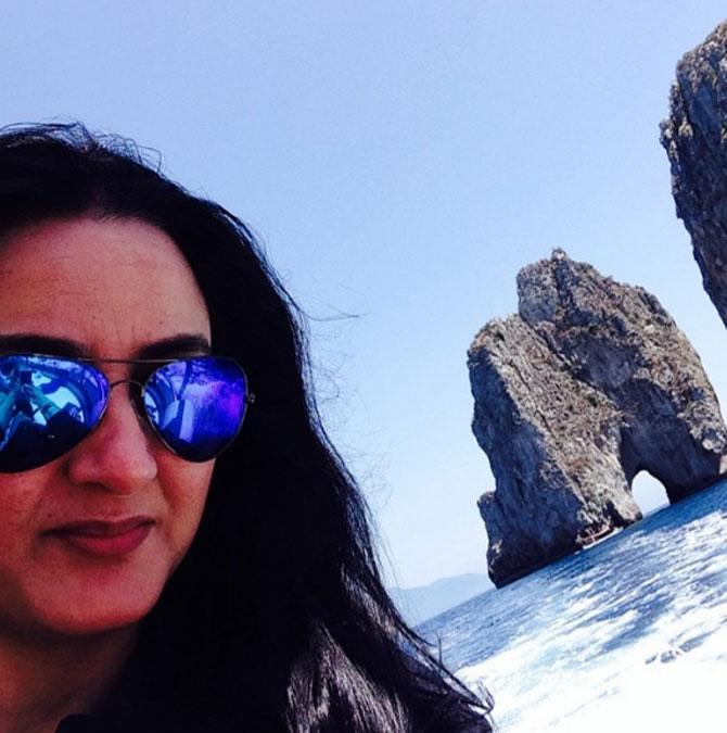 Farha Naaz posted this photo from her vacation diaries. She captioned it, '#capri #vacation #italy #selfie #beautiful #sunglasses #summer2014'.