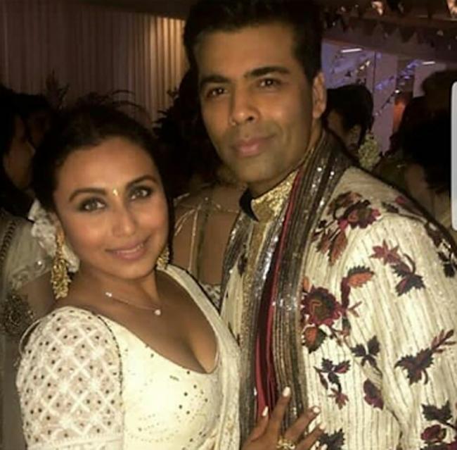 Karan Johar and Rani Mukerji pose for a picture during the sangeet ceremony of Sonam Kapoor and Anand Ahuja.