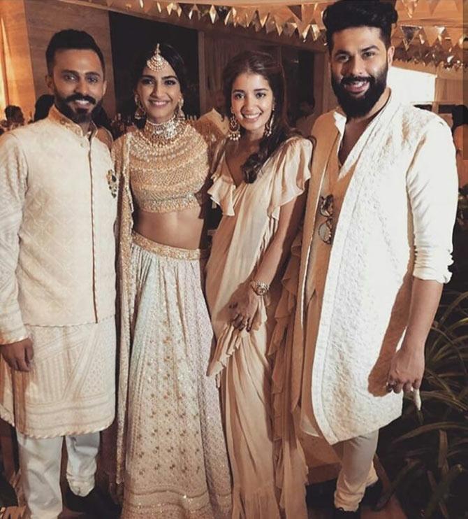 Designer Kunal Rawal, who is Sonam's childhood friend, poses for a picture at the sangeet ceremony of Sonam Kapoor and Anand Ahuja.