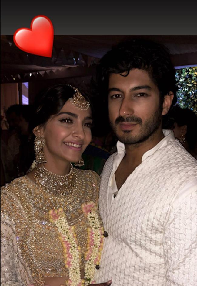 Mohit Marwah poses with the Sonam Kapoor during the sangeet ceremony.