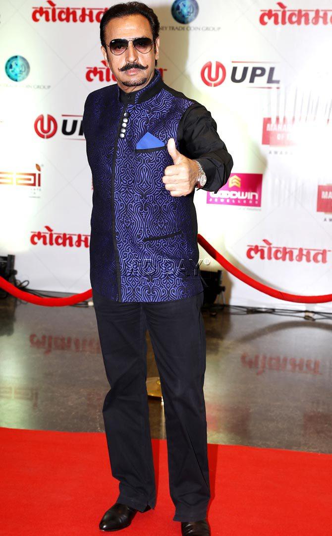 Gulshan Grover gives a thumbs up to photographers