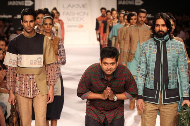 Sayantan Sarkar's collection had a few options for men too; well-cut layered jackets of different sizes worn over boxy shirts and trousers. He followed the layered separates route for women too. We had one grouse though. The Japanese Doll print seemed like an echo of the print that made the label Quirkbox famous. What we liked was the use of Jamdani weaves and the crisp jackets on show. In picture: Sayantan Sarkar bows to the audience.