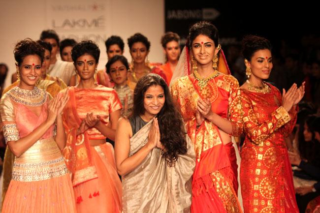 Designer Vaishali S, surrounded by a bevy of beautiful models on the runway greets the audience after the showcasing of her collection