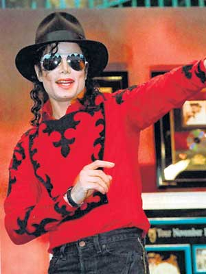 Jerry curls peeking from underneath the fedora hat, kohl-lined eyes resting behind mirrored aviator sunglasses, a smack of lip gloss and some rouge will eternally define Michael Jackson's personality.