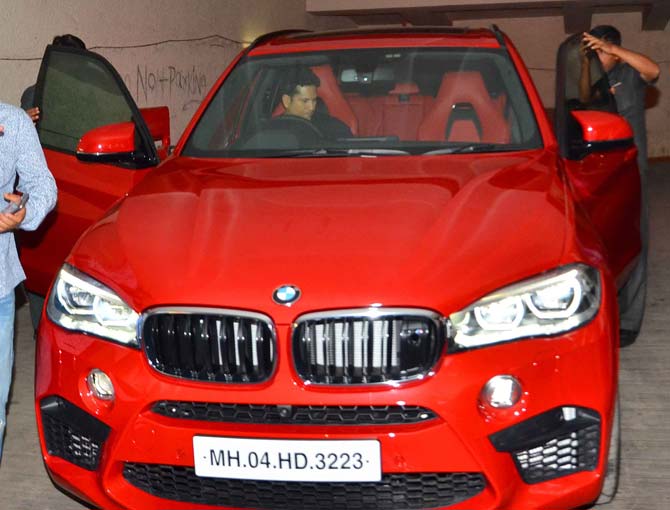 Sachin Tendulkar arrives for `Neerja` screening in his swanky red car Sachin Tendulkar arrives for `Neerja` screening in his swanky red car