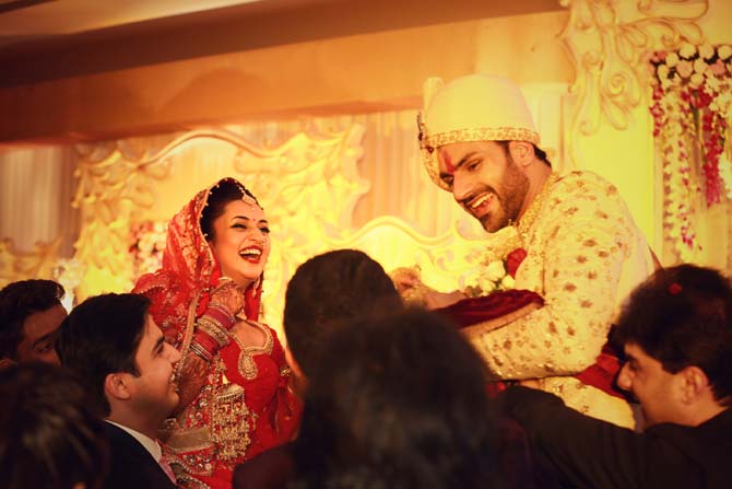 The venue, a plush resort, was beautifully lit up and the entrance was tastefully done. Sources say that a thick security cover kept the huge crowd gathered outside at bay. The two actors married according to traditional Hindu customs. In picture: Divyanka Tripathi and Vivek Dahiya at their wedding ceremony