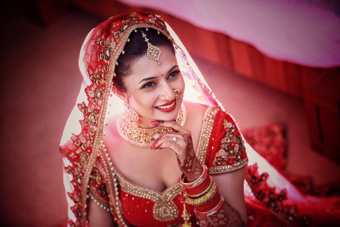 Divyanka Tripathi was quoted saying, 'I always wanted to wear red on the most important day of my life and my fiancé, agrees to that and has been designing the outfit keeping in mind the colour.' In picture: Divyanka Tripathi makes for a pretty bride, don't you agree?