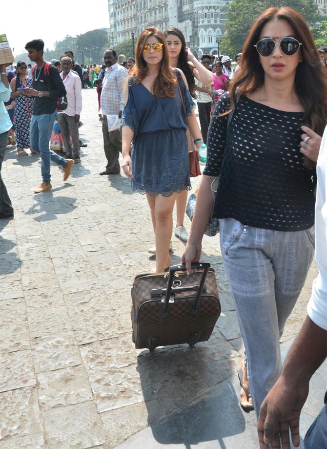 Bollywood actor-director Sohail Khan's wife Seema Khan (in black) followed by Bhavana Pandey and her daughter Ananya Pandey