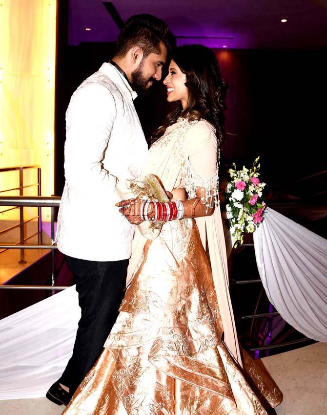 Kishwer Merchantt and Suyyash Rai happily pose for the photographers