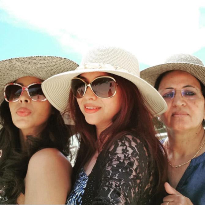 'I get emails from Haryana... from women saying, 'Show us the way'. They want to make something of their life. My activism is very important to me,' Mallika told IANS. In picture: Mallika Sherawat with her sister and mother in a picture from their holiday. Don't they make a terrific trio?