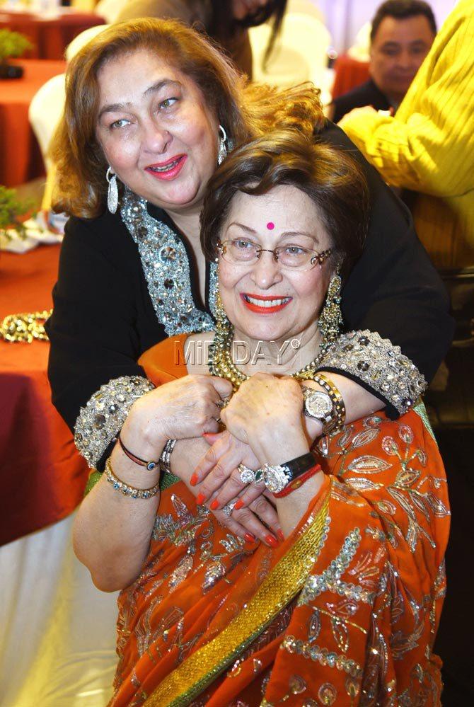 Reema Jain and Ritu Nanda pose for pictures at the launch of Ritu's book 'Raj Kapoor: The One and Only Showman' in Delhi
