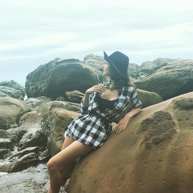 Sara Khan is a nature lover. See how she is enjoying the cool breeze in this photograph taken by the seashore.