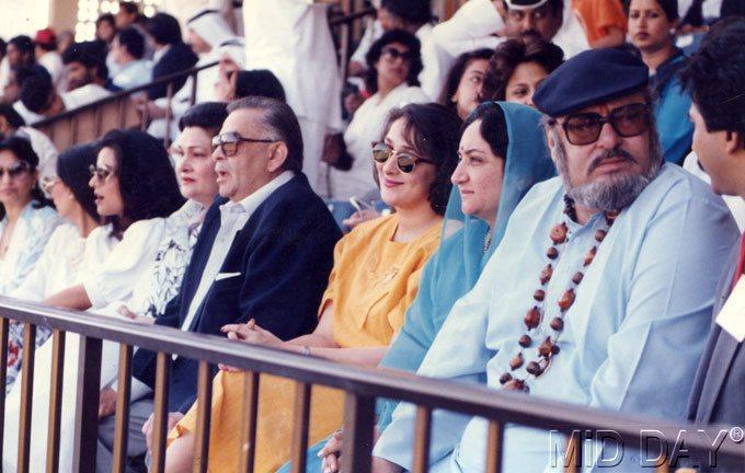 Raj Kapoor sitting next to his wife Krishna and Shammi Kapoor with his second wife Neela Devi. Shammi's first wife, Geeta Bali, passed away of smallpox in 1965