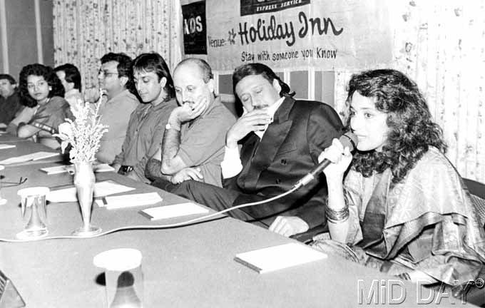 Madhuri Dixit at a press conference for the 1993 film Khalnayak. Also seen in the picture: Jackie Shroff (with eyes closed), Anupam Kher, Sanjay Dutt and Subhash Ghai.