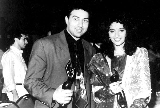 Born as Ajay Deol on October 19, 1956, into a Jat Sikh family in the village of Sahnewal in Punjab, India, to Hindi filmstar Dharmendra and Parkash Kaur, Sunny Deol has a younger brother Bobby Deol and two sisters Vijayta and Ajeeta who are settled in California. We all know how Dharmendra fell head over heels with the dream girl of Bollywood, Hema Malini. The actor is a step-son to Hema Malini, through whom he has two paternal half-sisters, actress Esha Deol and Ahana Deol. His cousin Abhay Deol is also an actor. In picture: Sunny Deol and Madhuri Dixit at a famous awards function.