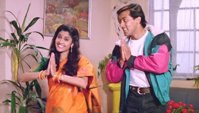 Renuka Shahane with Salman Khan in a still from Sooraj Barjatiya's Hum Aapke Hain Koun (1994). Renuka essayed Mohnish Behl's on-screen wife and Salman's sister-in-law in Sooraj Barjatiya's family entertainer