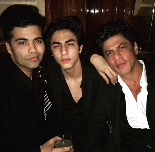 Shah Rukh Khan with son Aryan and friend Karan Johar at a bash.