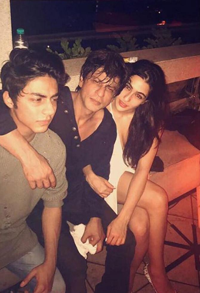 Aryan Khan has accompanied his father Shah Rukh Khan at several Bollywood parties. In this photo, SRK is seen posing with Aryan and Sara Ali Khan.