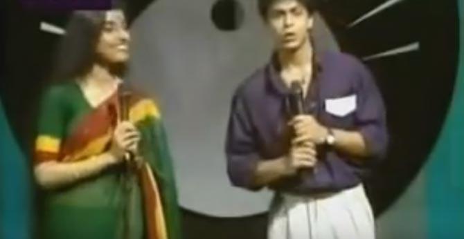 Music Show: We all know Bollywood superstar Shah Rukh Khan started his career from television. He has been part of several TV shows like 'Fauji' and 'Circus'. But were you aware that King Khan has also anchored a musical show on Doordarshan? In fact, a video of SRK hosting a show on DD and introducing singer Kumar Sanu went viral! Pic/YouTube