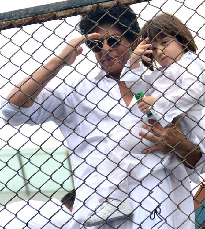 This has kind of become a ritual now! AbRam joins in with father Shah Rukh Khan to greet his fans and media on Eid outside their Bandra residence.
