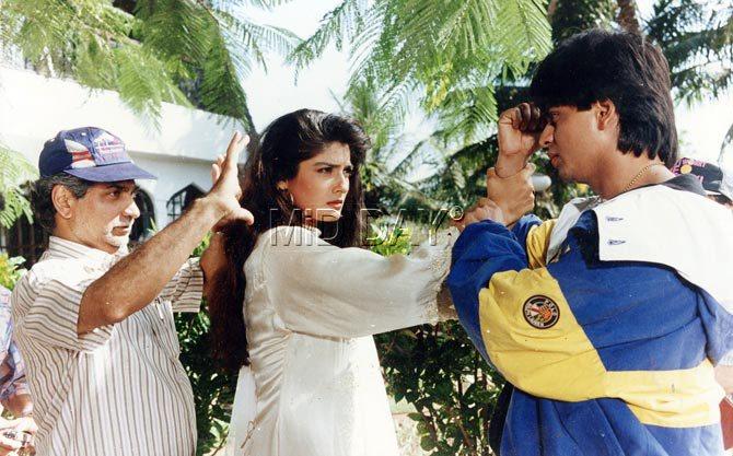Shah Rukh Khan and Raveena Tandon with director Ramesh Sippy on the sets of 'Zamaana Deewana' (1995)