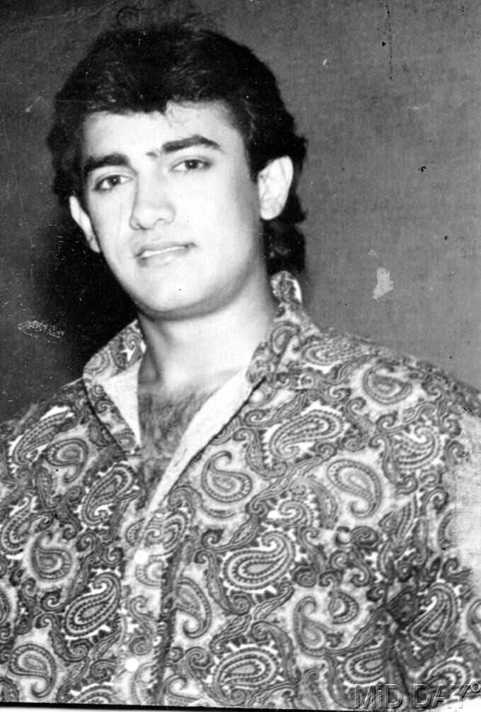 Aamir Khan was honoured with the Padma Shri in 2003 and the Padma Bhushan in 2010 by the Government of India.
In picture: Young Aamir Khan in a thoughtful mood. You won't see him wearing this kind of designer shirt anymore, but it was a trend in the '90s