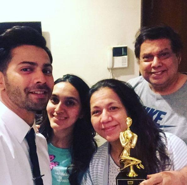Varun Dhawan with sister-in-law Jaanvi Desai, mom Karuna Dhawan and dad David Dhawan. Varun captioned this image, 'In his entire career I never saw my dad get excited when any of his films won awards. But he was really happy that I won for #dishoom tonight that too for a genre which is home for my family. Comedy is serious business. Thank you star screen (sic)'. Varun won the Zee Cine Award for Best Actor in a Comic Role, The Star Screen Award for Best Comedian and Best Performance in a Comic Role at the International Indian Film Academy Awards for his 2016 film Dishoom.