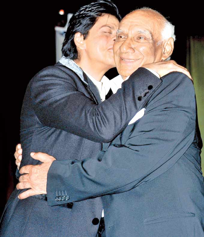 Two kings: Shah Rukh Khan hugs Yash Chopra to wish the legend on his birthday. Chopra played a very big part in establishing Shah Rukh Khan as the superstar with his film Darr and his son Aditya Chopra directed Dilwale Dulhania Le Jayenge, followed by Dil To Pagal Hai.