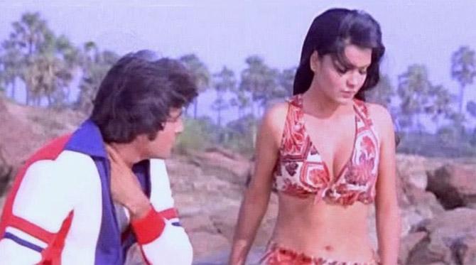 Zeenat Aman played the character of Sheela, a gorgeous disco club dancer and singer, who is in love with Rajesh (Feroz Khan), a thief, who hides his identity from his lady love. Qurbani became the biggest Indian hit of the year (1980). In picture: Zeenat Aman with Vinod Khanna in a still from Qurbani (1980).