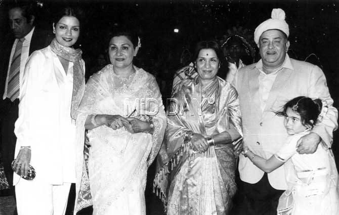 In picture: Zeenat Aman with her mother (third from right), Raj Kapoor, Krishna Raj Kapoor and a young Karisma Kapoor.