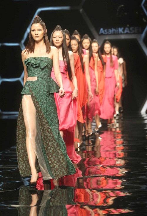 This picture taken on October 27, 2013 shows models parading creations from the Asahi Kasei Collection during China Fashion Week in Beijing