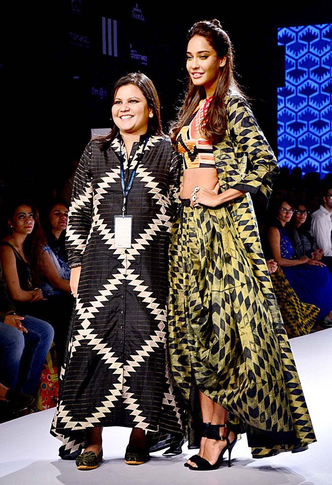 Lisa Haydon in an embroidered crop top paired with a long kurta jacket, one of the creations by designer Swati Vijaivargie