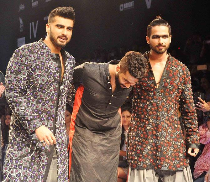 Arjun Kapoor and Shahid Kapoor with designer Kunal Rawal (centre)