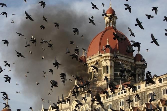Smoke billows out of the Taj Mahal Hotel. Fear and anger had seeped through the masses after the terror attack.