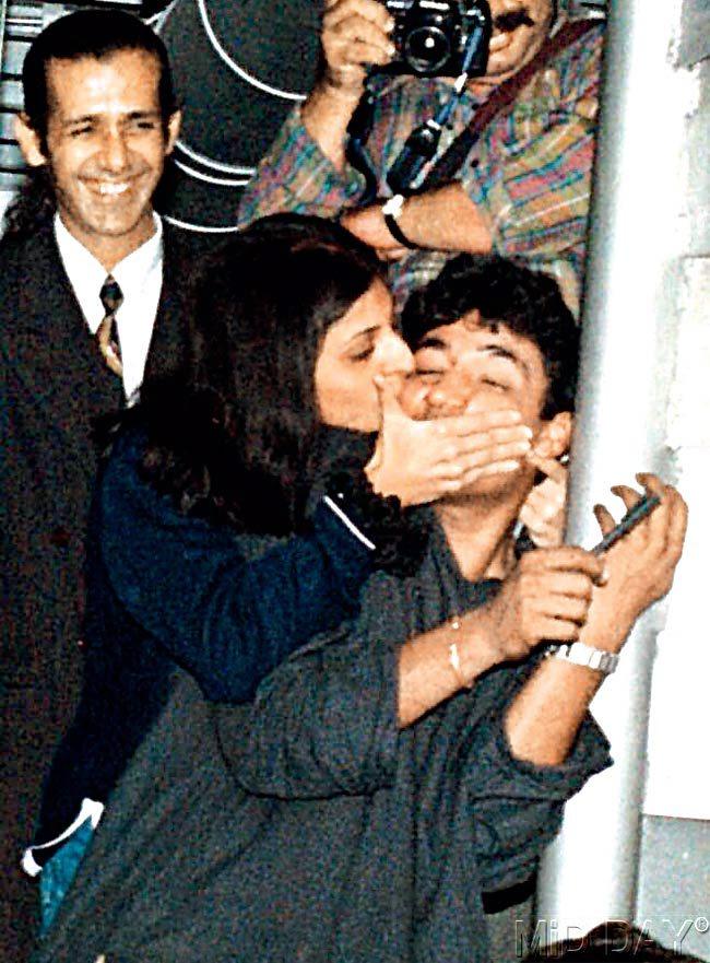 #23 August 10, 2009  FOR YOU, AJOO: A girl lands one on Ajay Jadeja. Pic/NIMESH DAVE