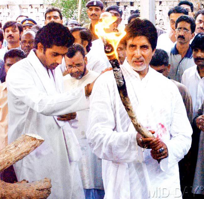 #20 January 19, 2003  FAREWELL FIRE: Amitabh and Abhishek Bachchan during the funeral of Harivanshrai Bachchan in 2003 at Juhu. Pic/RANE ASHISH
