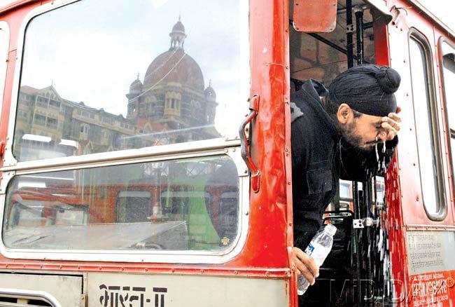 #10 November 29, 2008  WASH AND FACE IT: A National Security Guard (NSG) jawan washes his face near the Taj Mahal hotel after a three-day terrorist siege ended. Pic/RANE ASHISH