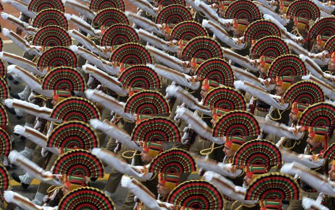 An Indian Army contingent marches past during the Republic Day Parade in New Delhi on January 26, 2016. Thousands gathered in New Delhi amid tight security January 26 for India's annual Republic Day parade, a pomp-filled spectacle of military might featuring camels and daredevil stuntwomen, with French President Francois Hollande the chief guest. AFP PHOTO