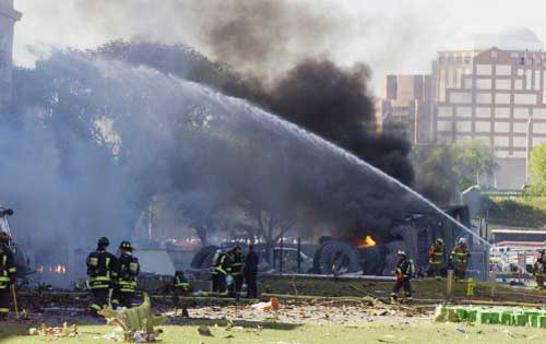 Emergency personnel battle a fire at the Pentagon in Washington, DC, 11 September, 2001 after an airplane crashed into it. At the same time, two passenger planes were crashed into the twin towers of the World Trade Center in new York City. Both towers collapsed. Pic/AFP